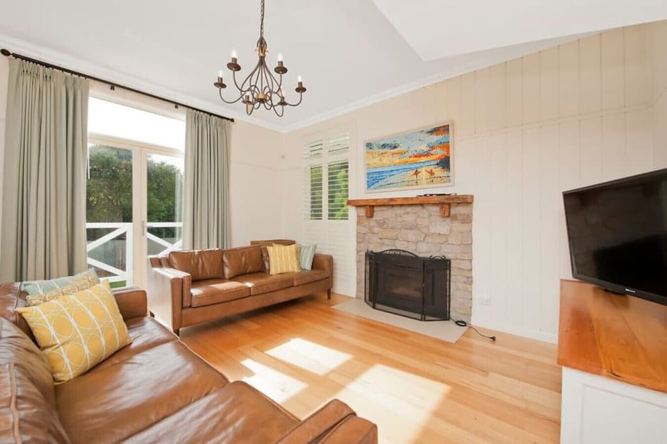 Family room downstairs - ample seating for 8 guests - adjoins meals and kitchen. French doors open out onto lower porch and offers access to backyard.