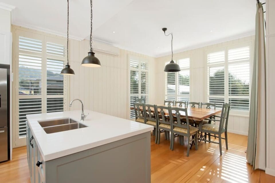 Kitchen is adjoined by meals area with ample room for 10 at the table (as well as two seats at the breakfast bar). High chair available for infants.