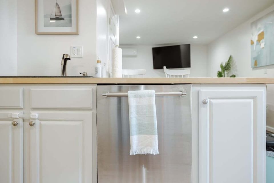 Spacious kitchen with full appliances, cookware, spices, and essentials.