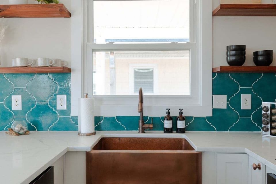 Cook with ease in the fully updated kitchen featuring modern appliances, induction stovetop, cookware, coffee maker, and everything needed for preparing meals at home