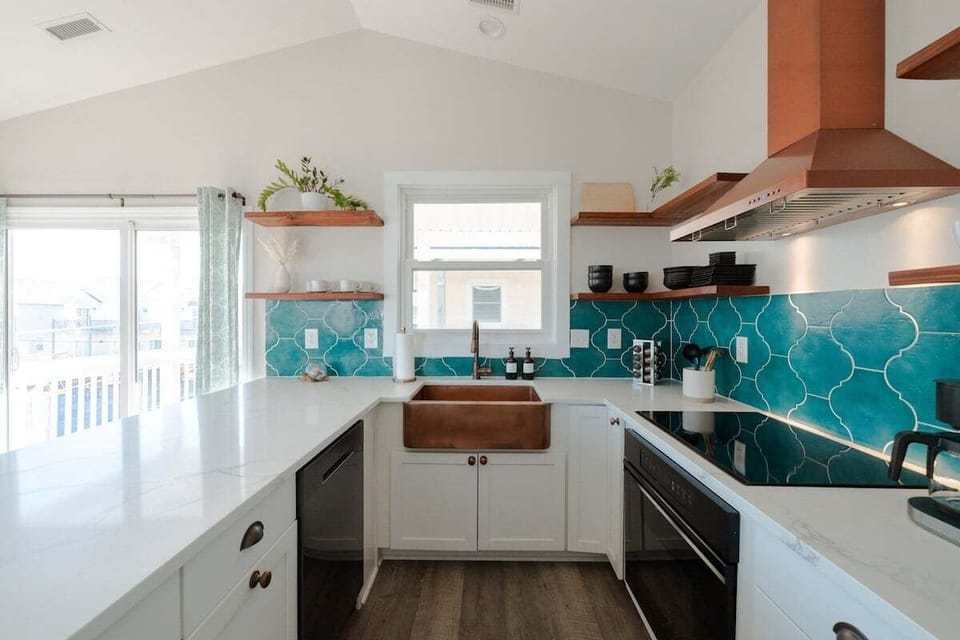 Cook with ease in the fully updated kitchen featuring modern appliances, induction stovetop, cookware, coffee maker, and everything needed for preparing meals at home
