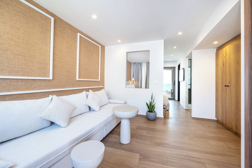 Elegant Suite with Sea View | Living area | 32-inch Smart TV with cable channels