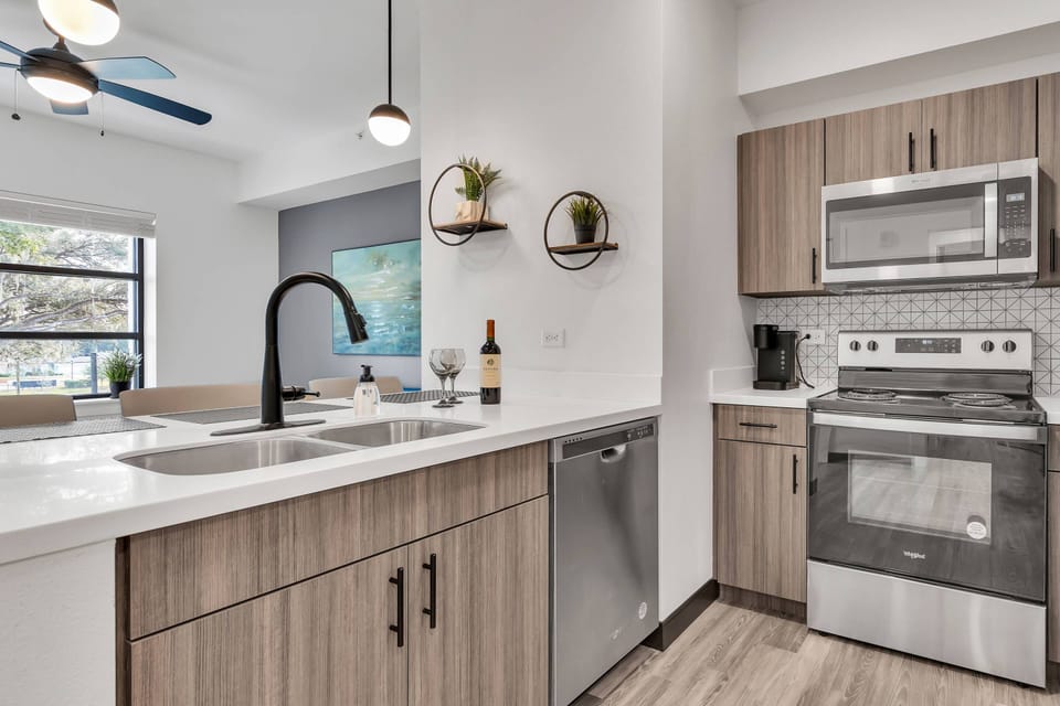 Kitchen includes a refrigerator, microwave, dishwasher, electric range, Keurig pod coffee maker, toaster & much more!