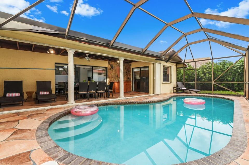 Screened in pool and patio, perfect for outdoor living all year around in sunny South Florida!