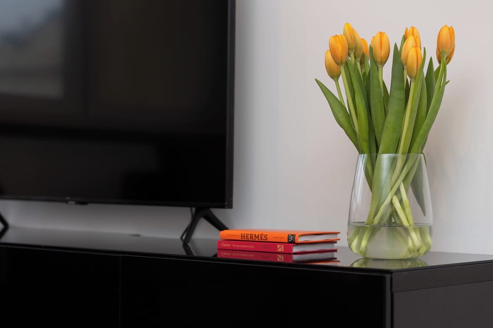 Enjoy your favorite shows on the flat-screen television in the elegant living area.