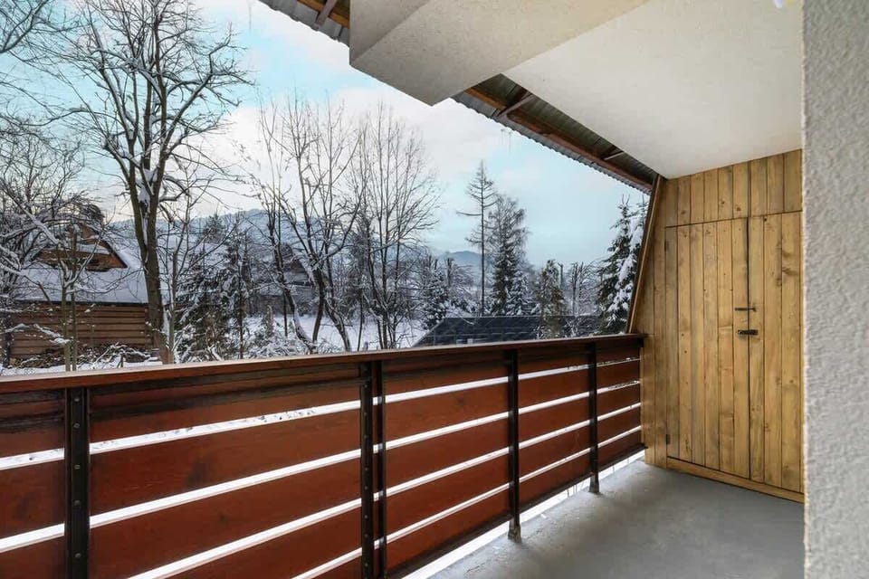 The balcony from a different angle, showcasing the spacious area and beautiful snowy scenery.

