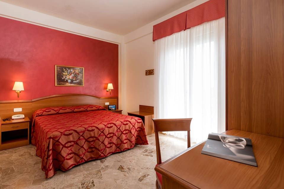 Premium bedding, down comforters, in-room safe, desk