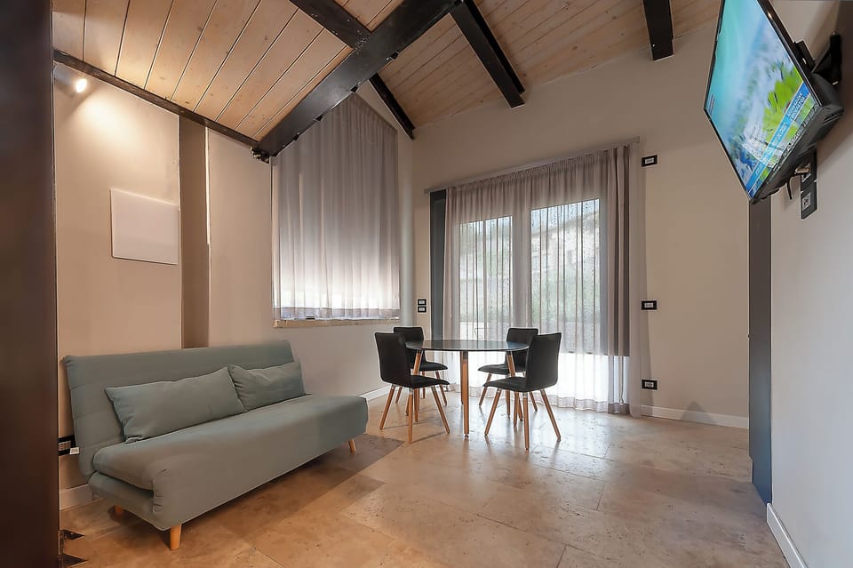 Junior Suite, 1 Bedroom, Garden View | Living area | 35-inch Smart TV with digital channels, streaming services