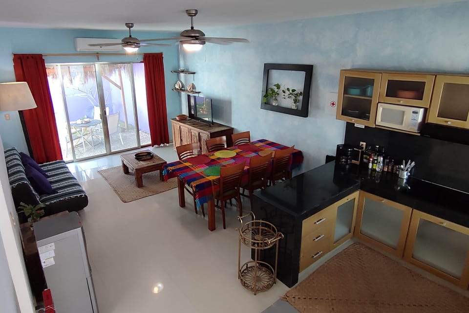 Overall view of living room, dining area and kitchen