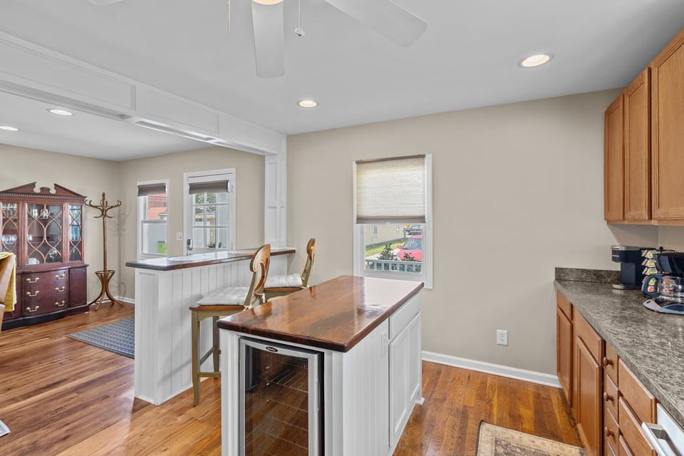 Kitchen island with wine cooler.