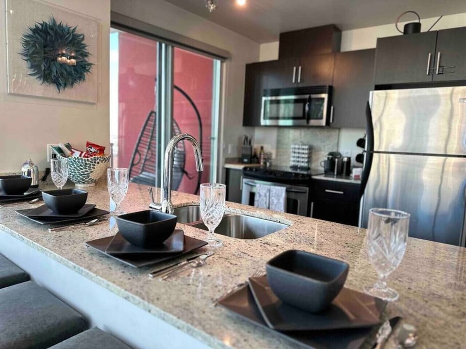 The kitchen comes well equipped. The bar counter has room for four to sit and eat.