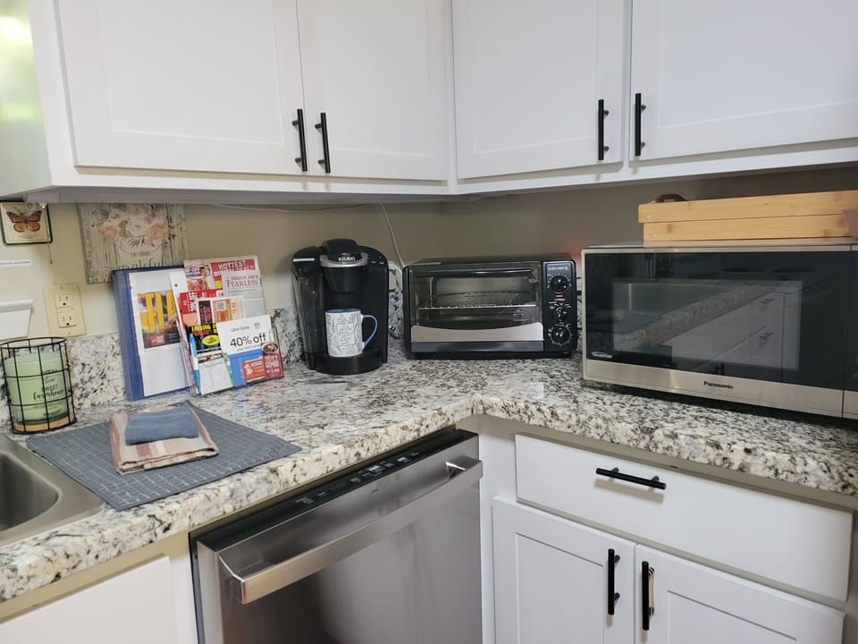 Keurig, toaster oven, microwave, stocked pantry and refrigerator/freezer