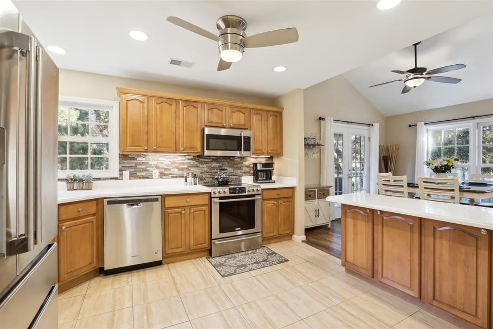 Fully equipped kitchen with modern stainless steel appliances
