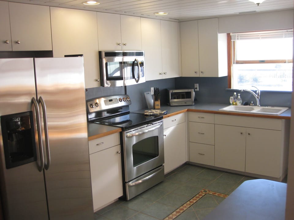 Kitchen with view out to the pool.