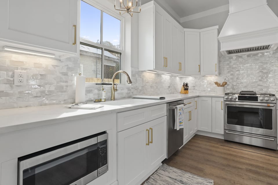 Microwave, dishwasher, and 6-burner gas stove.