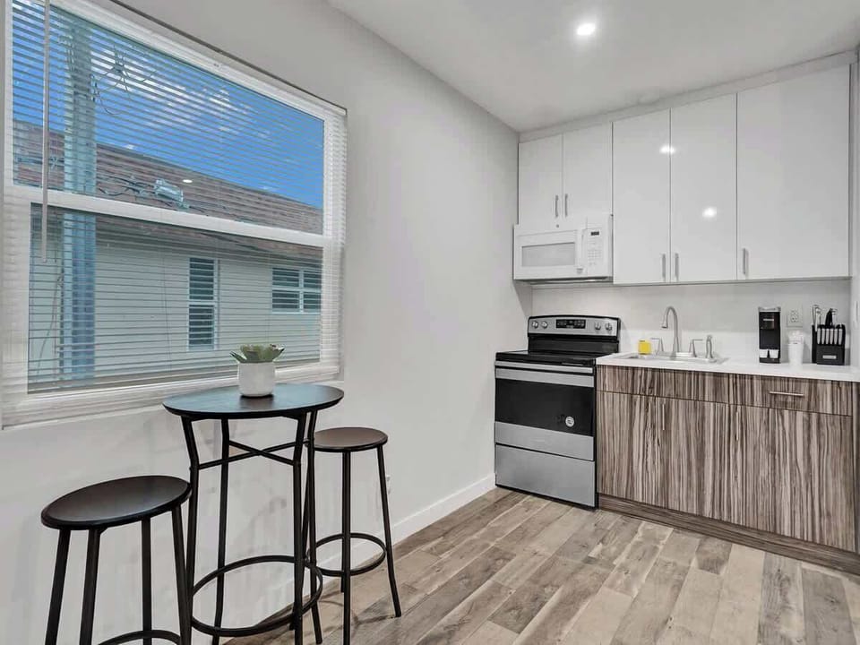 Kitchen with large window and bistro seating