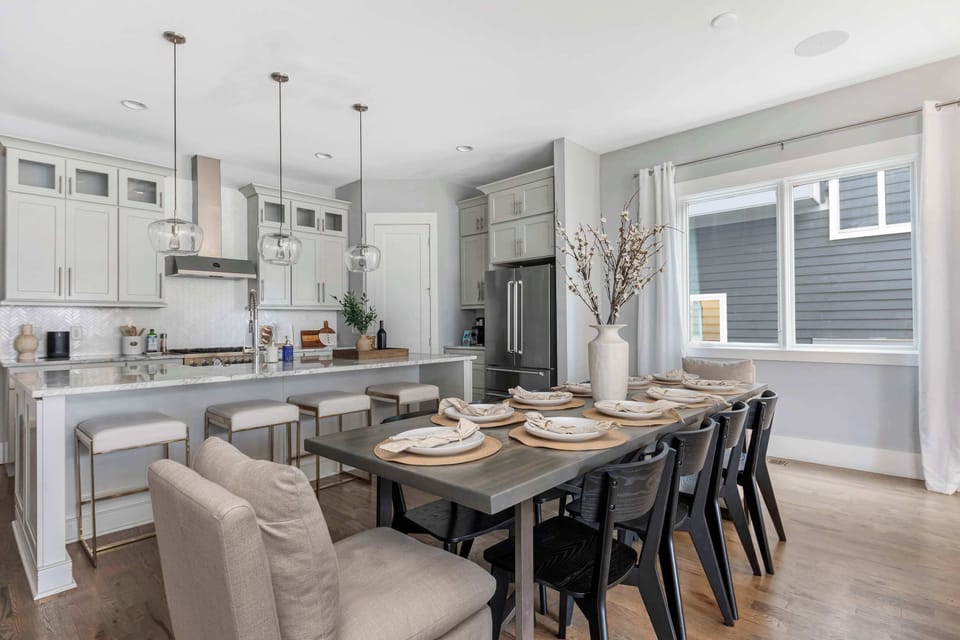 Ample elbow room at the large dining table, comfortably seating 8 guests, with additional seating for 4, making it perfect for gatherings and family meals.
