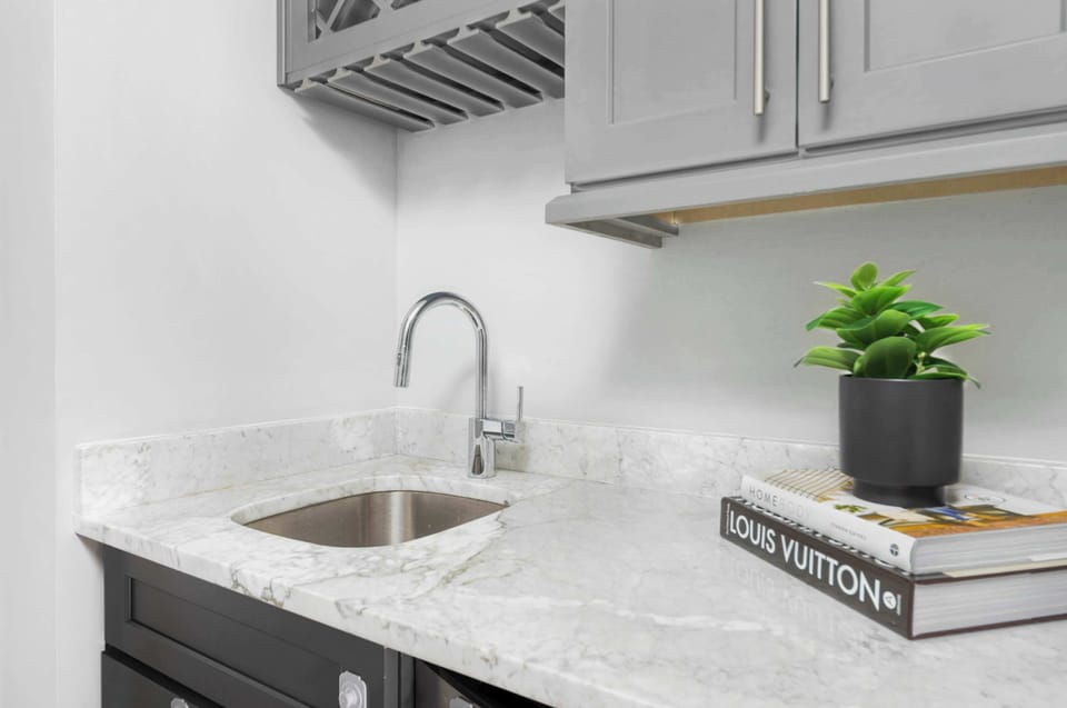 The wet bar on the top floor creates the perfect entertaining space, offering both convenience and style.