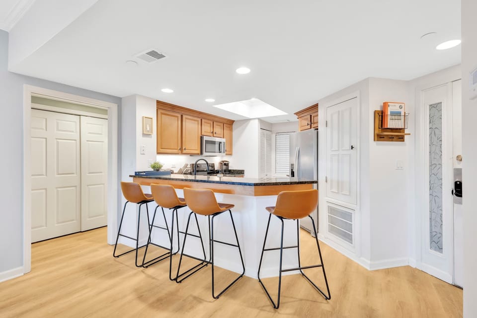 Casual & Cozy: Pull up a seat at the kitchen island’s bar seating—perfect for a quick bite, morning coffee, or chatting while the chef works their magic.