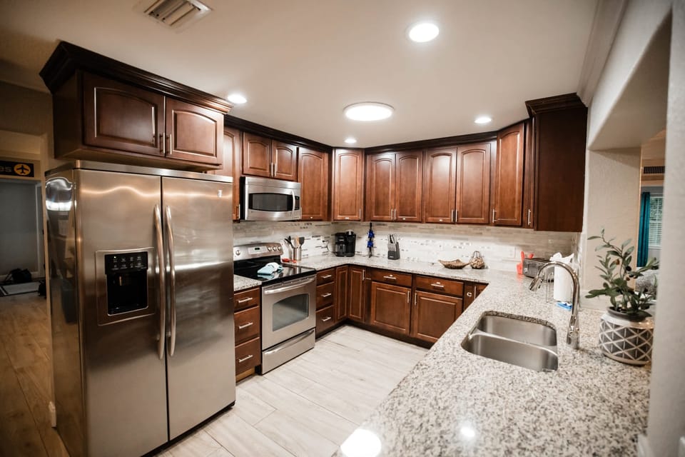 This beautifully designed kitchen boasts high-end appliances, polished surfaces, and spacious countertops—perfect for gourmet cooking and memorable gatherings.