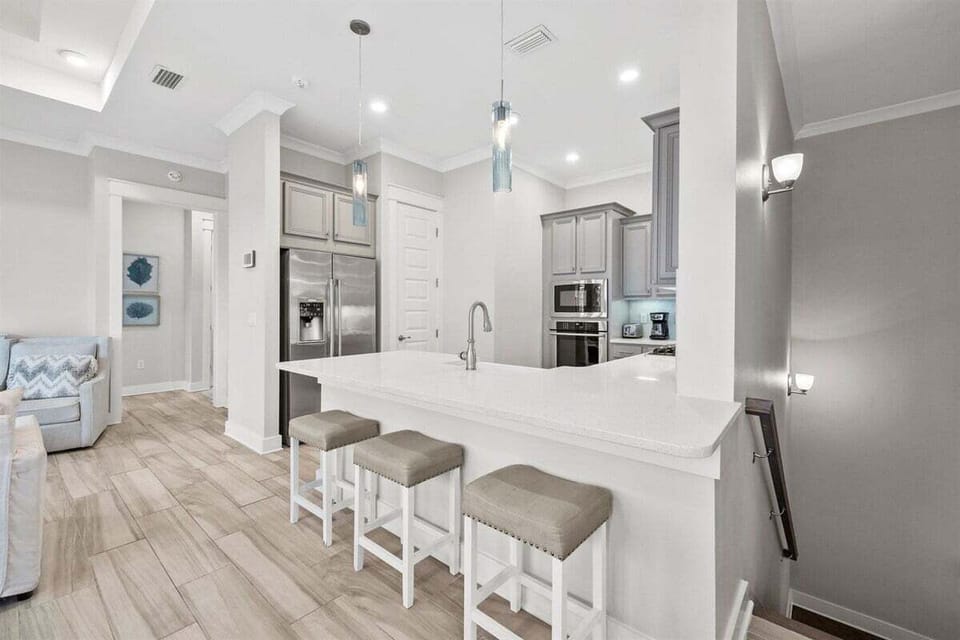 Cook and entertain in this sleek, fully equipped kitchen with a spacious island.