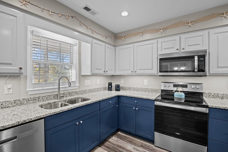 Beautiful granite countertops and dishwasher.