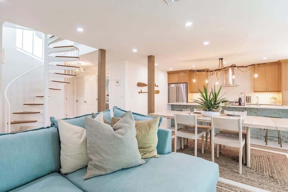 Perfectly designed for socializing, relaxation, and making lasting memories, this vibrant space seamlessly combines the living, dining, and kitchen areas.