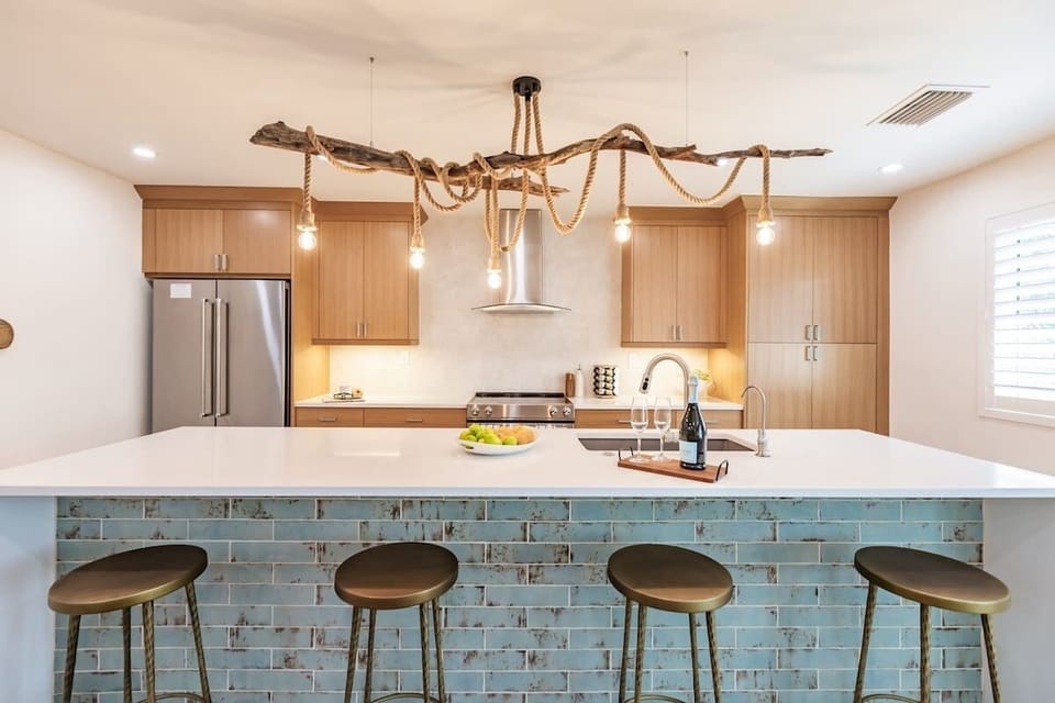 The kitchen boasts top-of-the-line appliances, ample counter space, and all the essentials you need to channel your inner chef.