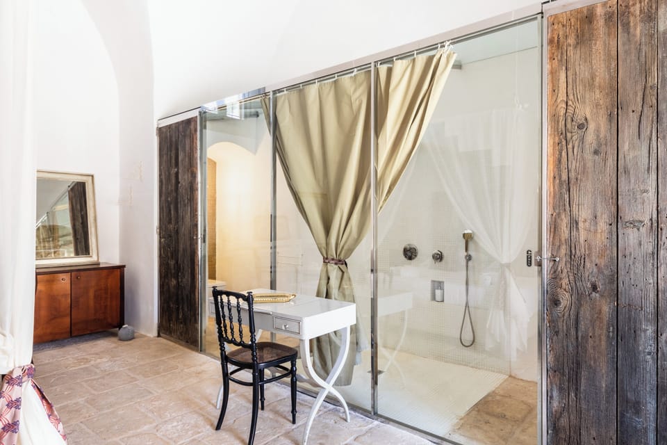 Deluxe Room | Bathroom | Shower, designer toiletries, hair dryer, slippers