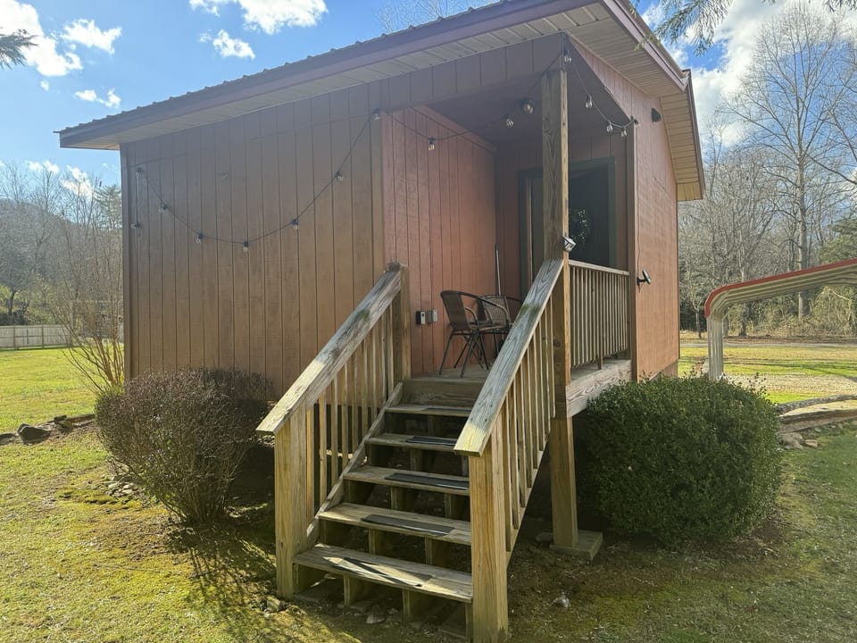 Each Cabin offers an inviting front porch with seating to enjoy the view