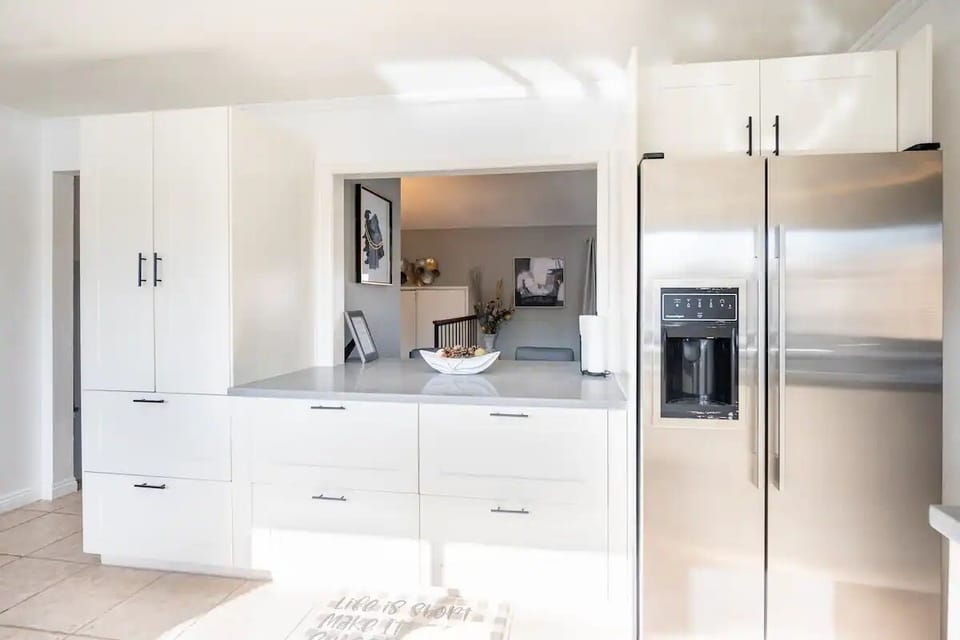 Kitchen bar opens into dining area for fun and easy mingling!