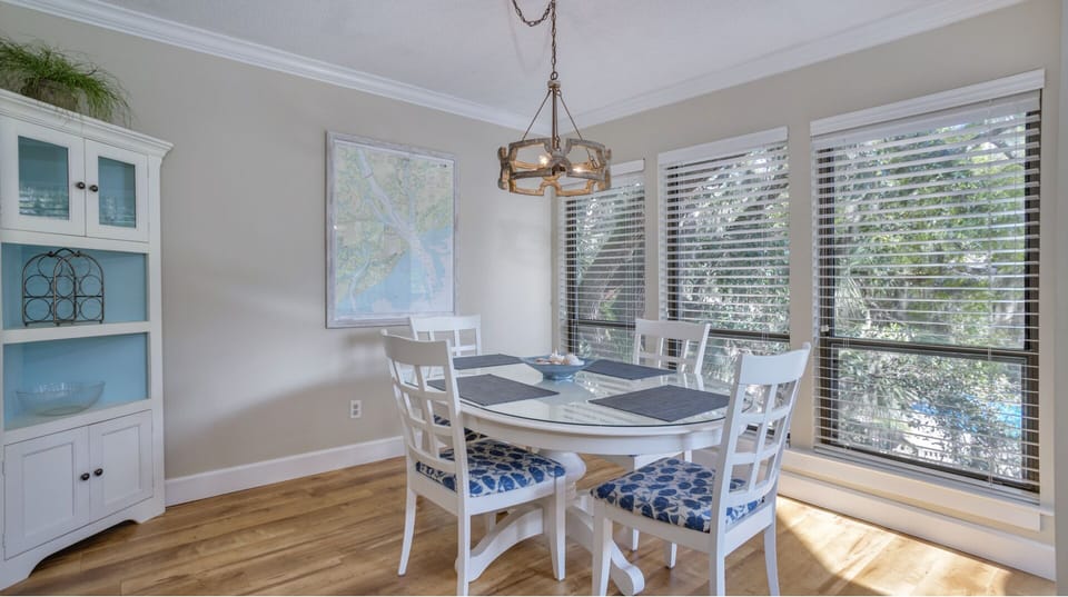 A bright, welcoming dining space that connects seamlessly to the living area and private balcony.