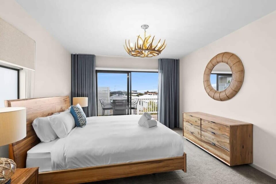 The upper level features the master suite, with a King-size bed and sea view balcony