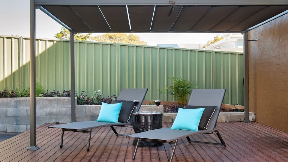 Aloha Beach House | Outdoor Area | Sun lounges | Enclosed yard | Pet friendly