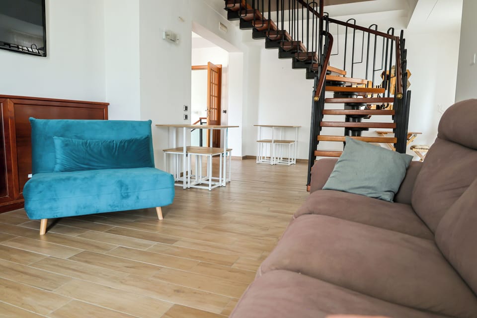 Panoramic Triple Room | Living area | Flat-screen TV, fireplace
