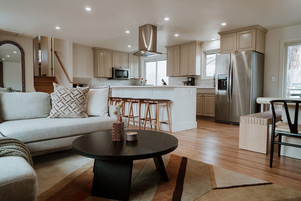 - Open concept space brings everyone together for lounging, cooking, and sipping wine
- Fully equipped kitchen or gather at the island for morning coffee
- Earthy tones, plush seating, and designer touches create comfort that feels elevated