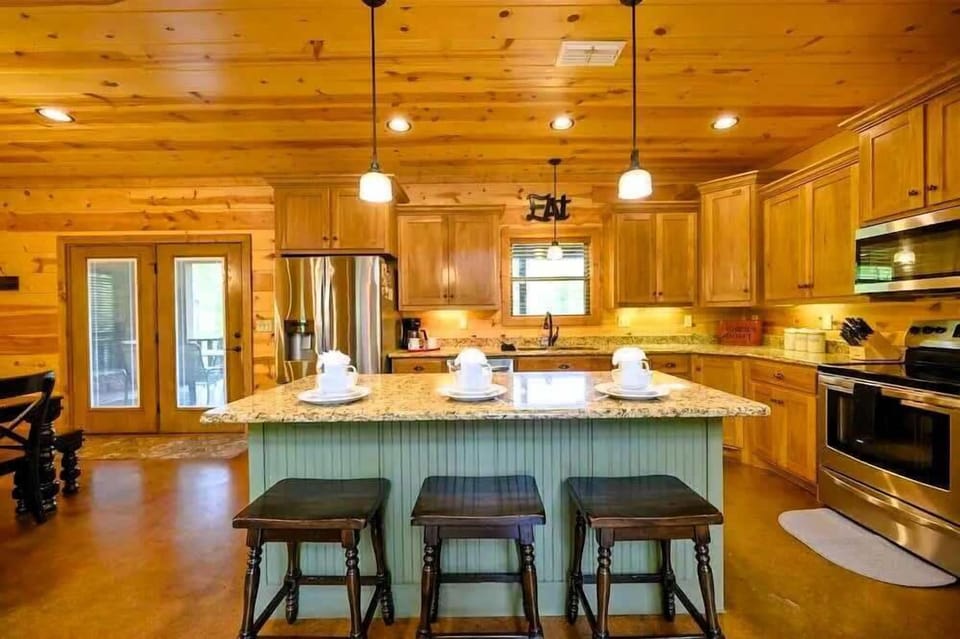 3 can sit comfortably at the large kitchen island.