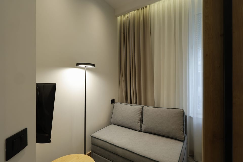 Junior Suite | Living area | 40-inch Smart TV with cable channels