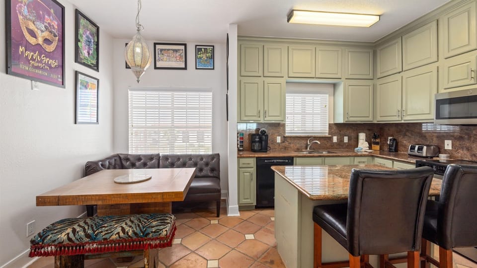 Kitchen and dining with a breakfast nook seating 4