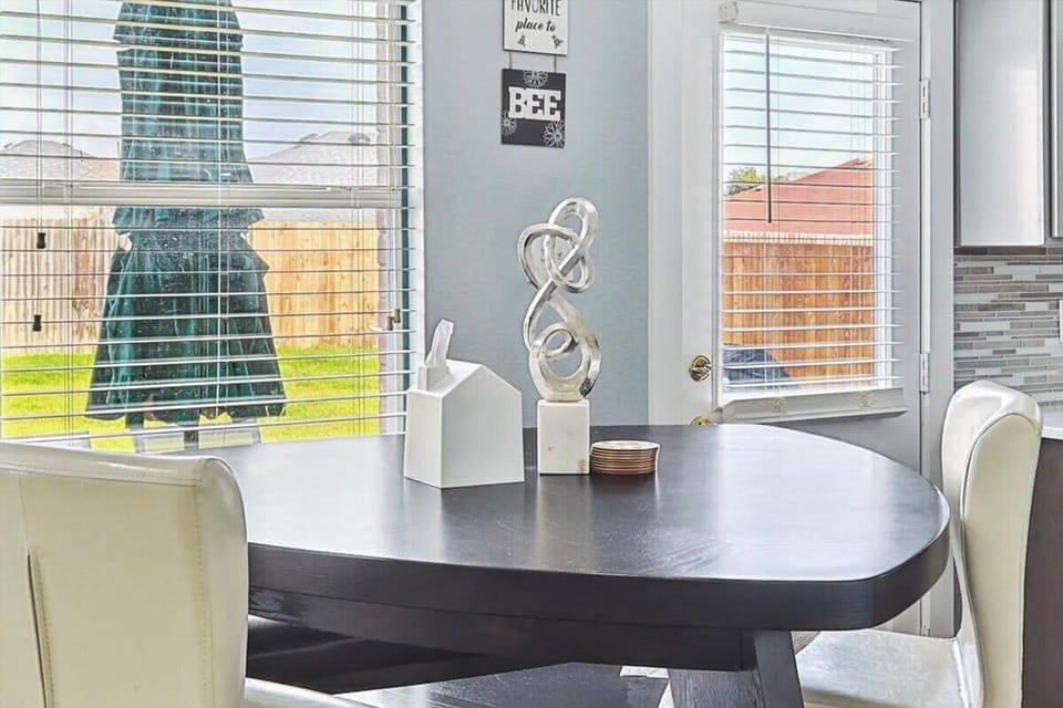 This adorable breakfast nook located next to the kitchen with a view of the backyard is the best place for enjoying your first morning sips of coffee!