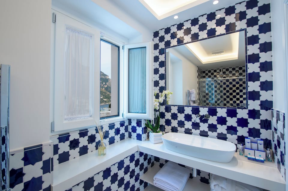 Suite (Fornillo) | Bathroom | Designer toiletries, hair dryer, bathrobes, slippers