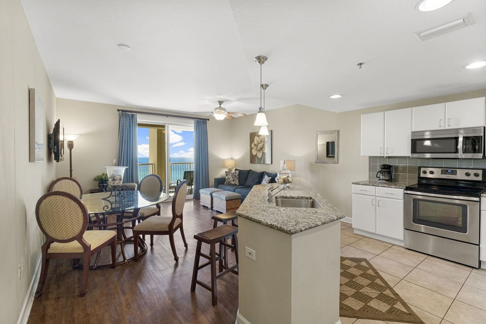 Open-concept kitchen and living area with ocean views and modern furnishings