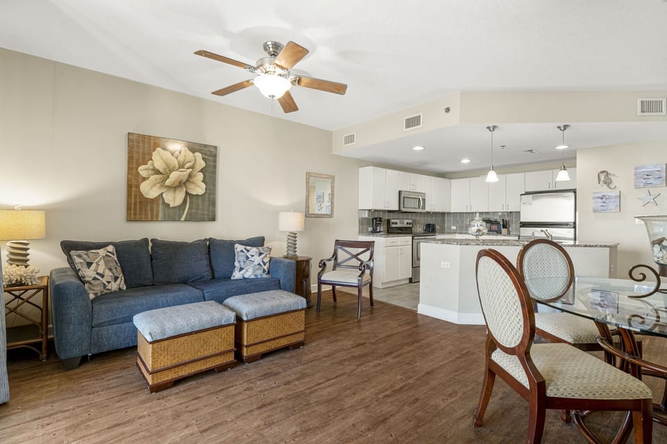Open-concept living area with modern kitchen and comfortable seating