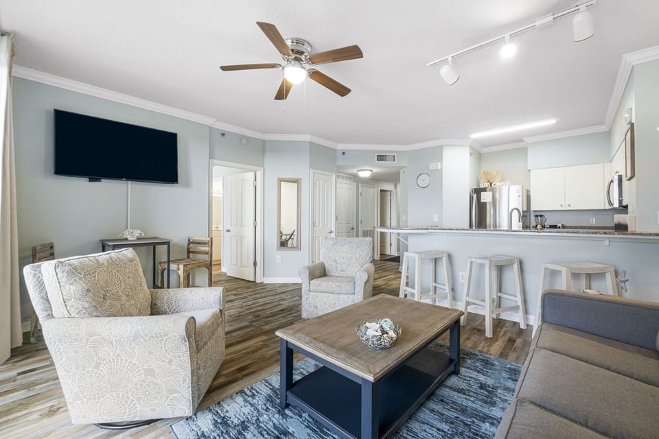 Open-concept living area with modern kitchen and comfortable seating.