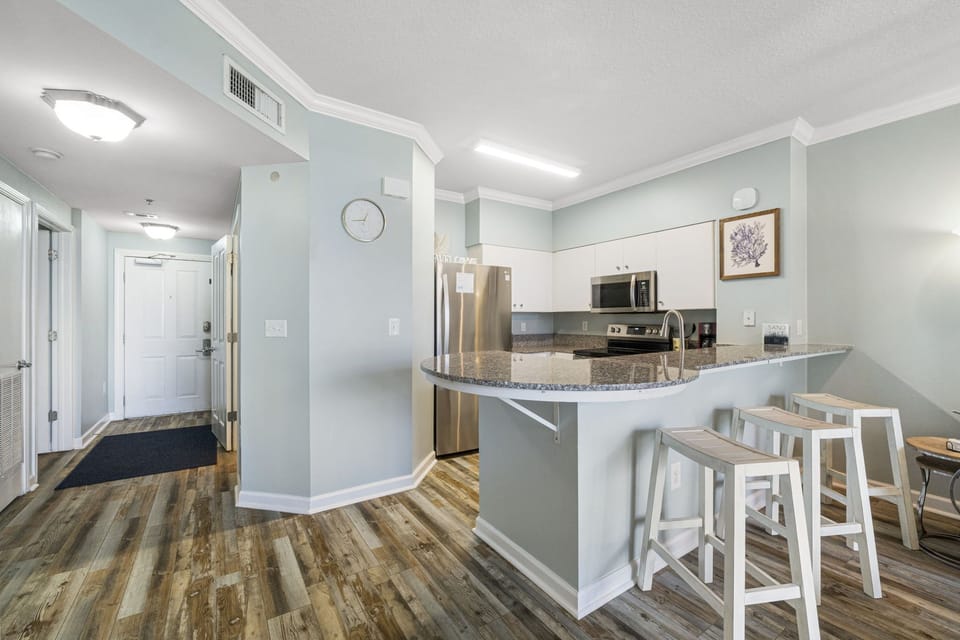 modern kitchen with granite countertops and stainless steel appliances