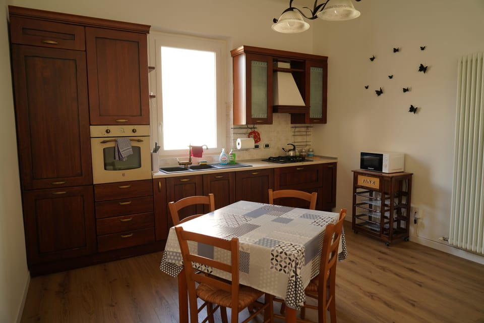 Apartment | Private kitchen | Full-size fridge, oven, cookware/dishes/utensils