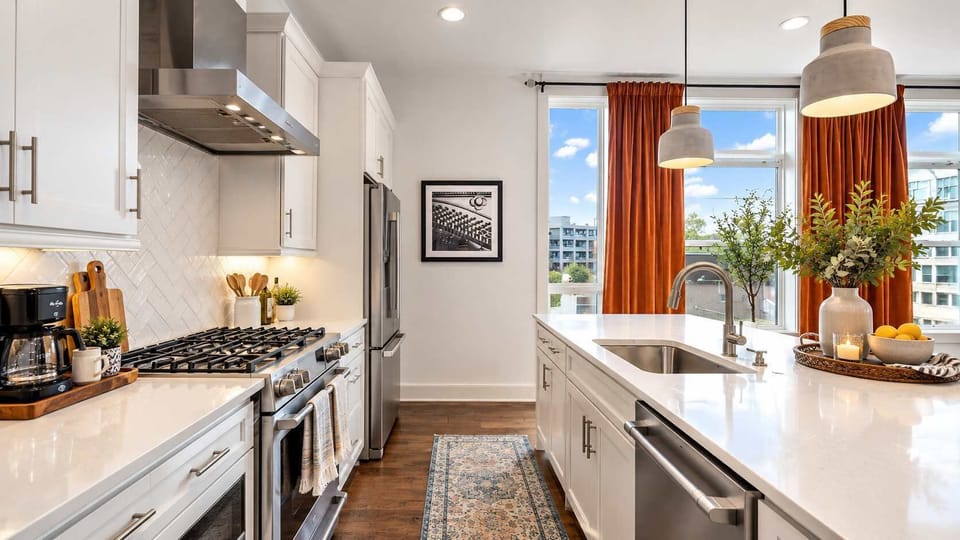 Bright, sun-filled kitchen creating a warm, inviting space for cooking, dining, and gathering.