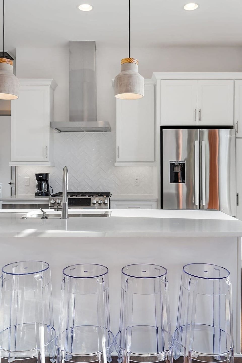 Kitchen island counter with cute transparent chairs!