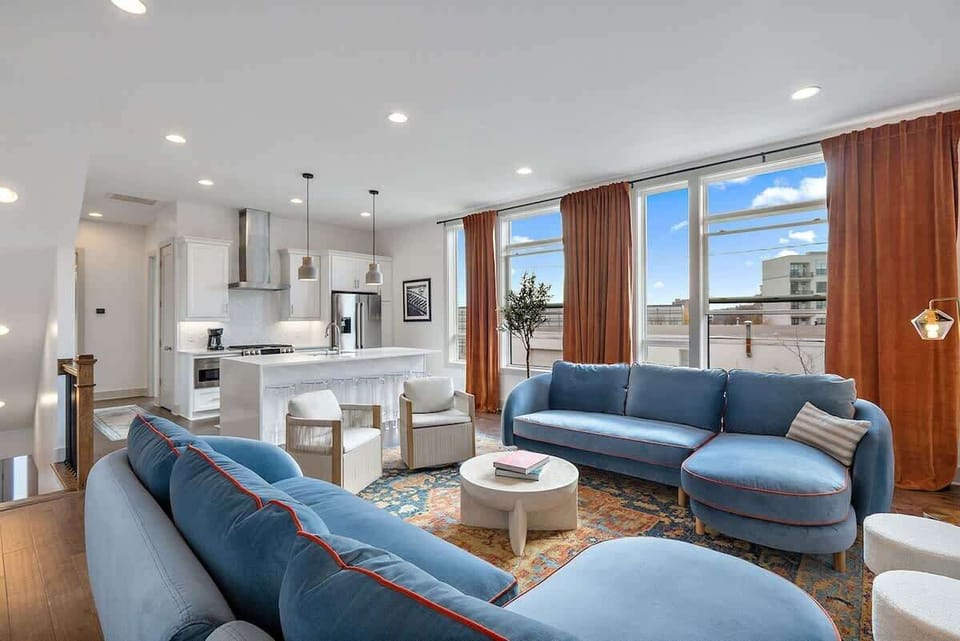 Bright and airy living space with stylish furnishings and stunning city views, perfect for relaxing in the heart of Nashville.