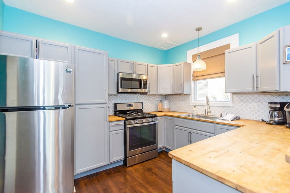 Full kitchen from dining area.